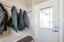 White entry door with decorative glass panel and satin nickel hardware - 803 12 Avenue, Cold Lake, AB  - Indoor With Storage 