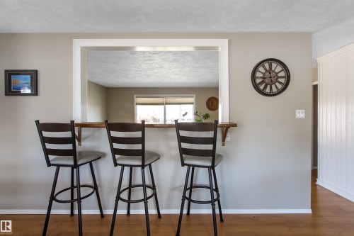Pass-through window with a wood-finish bar top - 803 12 Avenue, Cold Lake, AB - Indoor