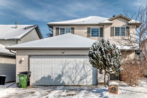 Two-story residence featuring light-toned siding and a two-car attached garage - 19024 50 Avenue, Edmonton, AB - Outdoor