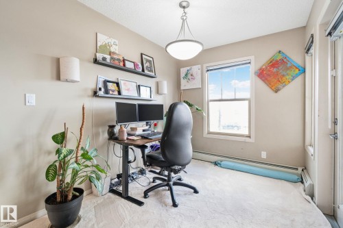 Interior room featuring light beige wall paint, white trim, and light-colored carpeting - 206 103 Ambleside Drive, Edmonton, AB - Indoor Photo Showing Office