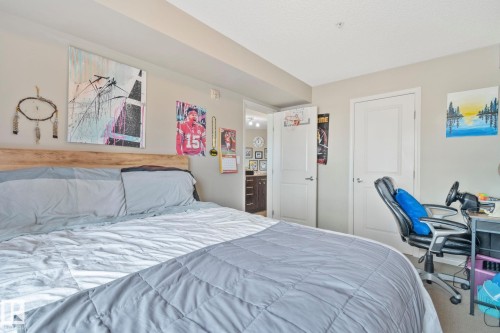 Bedroom featuring a light wood-finish headboard and neutral wall color - 206 103 Ambleside Drive, Edmonton, AB - Indoor Photo Showing Bedroom