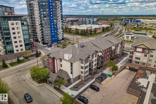 Multi-story residential building with a contemporary design featuring balconies and varied exterior finishes - 206 103 Ambleside Drive, Edmonton, AB - Outdoor With View