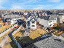 Contemporary two-story residence with white siding and black trim accents - 6613 62 Avenue, Beaumont, AB  - Outdoor 