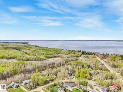 Expansive waterfront with significant tree coverage - 