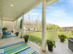 Spacious covered porch featuring concrete flooring and recessed lighting - 