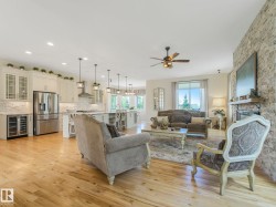 Open-concept living area featuring light wood-finish flooring - 