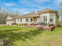 Expansive rear deck featuring composite material, integrated lattice skirting, and ample room for outdoor furniture - 