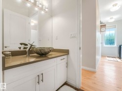 Vanity featuring a vessel sink with a unique basin and a contemporary faucet - 