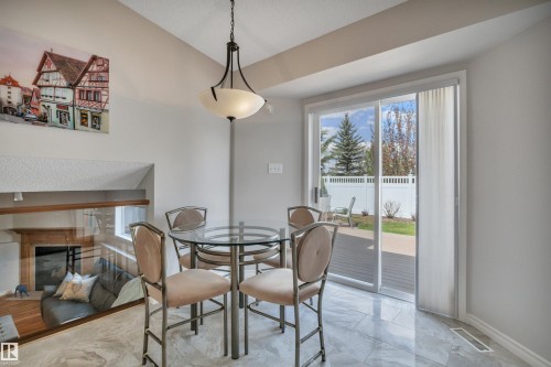 117 Hollick-Kenyon Way, Edmonton, AB - Indoor Photo Showing Dining Room With Fireplace