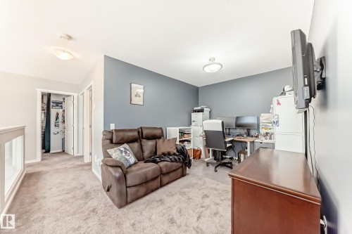 Upper-level landing featuring carpet flooring and white painted trim - 267 Sturtz Bend, Leduc, AB - Indoor