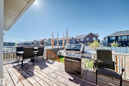 Spacious outdoor deck featuring natural wood planks and white painted railings - 267 Sturtz Bend, Leduc, AB - Outdoor With Deck Patio Veranda With Exterior