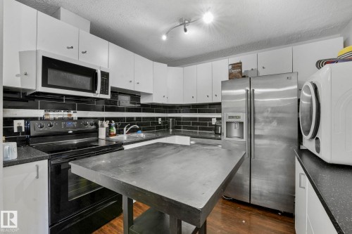 A7 2808 116 Street, Edmonton, AB - Indoor Photo Showing Kitchen With Double Sink
