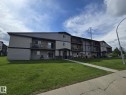 Multi-story residential building featuring balconies and ground-level patios - A7 2808 116 Street, Edmonton, AB  - Outdoor With Balcony 