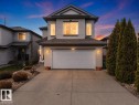 Two-story residence featuring light gray siding and a dark shingle roof - 3356 25 Ave, Edmonton, AB  - Outdoor With Facade 