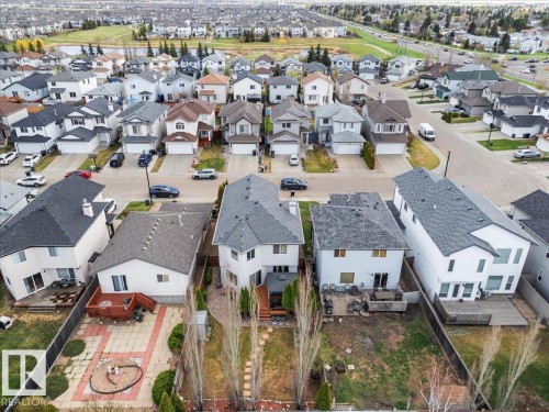 Residential neighborhood with detached homes, shingled roofs, and private backyards - 3356 25 Ave, Edmonton, AB - Outdoor With View
