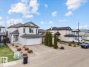 Two-story residence featuring light-colored siding and a dark shingle roof - 3356 25 Ave, Edmonton, AB  - Outdoor With Facade 