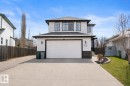 Two-story residence featuring light-colored siding with dark trim accents - 112 Lakeland Point(E), Beaumont, AB  - Outdoor 