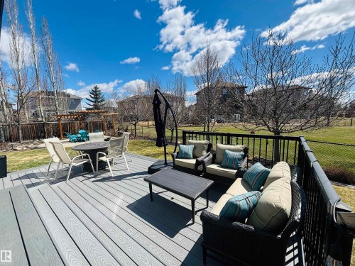 Spacious composite deck with dark railings - 112 Lakeland Point(E), Beaumont, AB - Outdoor With Deck Patio Veranda