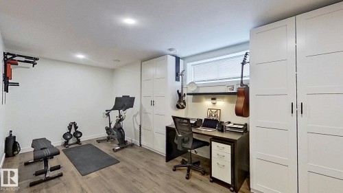37 Emberside Link, Cochrane, AB - Indoor Photo Showing Gym Room