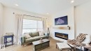 37 Emberside Link, Cochrane, AB  - Indoor Photo Showing Living Room With Fireplace 