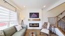 37 Emberside Link, Cochrane, AB  - Indoor Photo Showing Other Room With Fireplace 