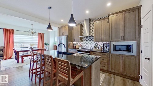 37 Emberside Link, Cochrane, AB - Indoor Photo Showing Kitchen With Upgraded Kitchen