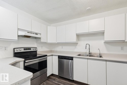 411 9010 106 Avenue, Edmonton, AB - Indoor Photo Showing Kitchen With Double Sink