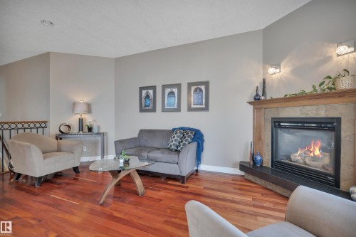 59 Wilkinson Place, Leduc, AB - Indoor Photo Showing Living Room With Fireplace