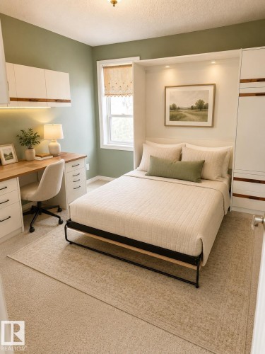 Built-in desk with overhead cabinetry and task lighting - 219 9535 176 Street, Edmonton, AB - Indoor Photo Showing Bedroom