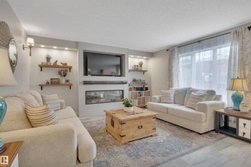 6509 38 Avenue, Beaumont, AB - Indoor Photo Showing Living Room With Fireplace