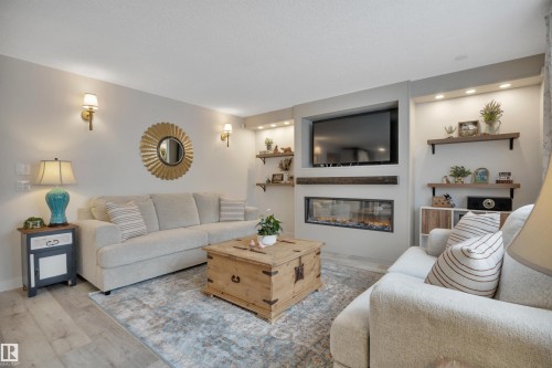 6509 38 Avenue, Beaumont, AB - Indoor Photo Showing Living Room With Fireplace
