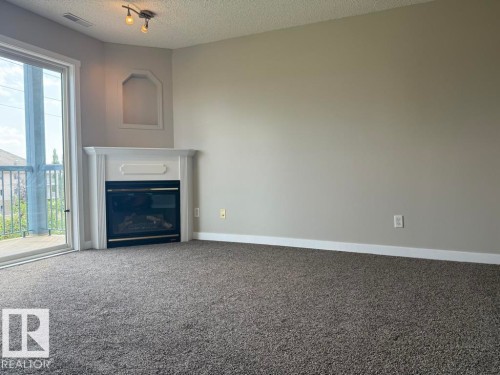 316 16303 95 Street, Edmonton, AB - Indoor With Fireplace