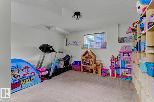 Carpeted room with recessed lighting and a single window featuring horizontal blinds - 3208 135A Avenue, Edmonton, AB - Indoor Photo Showing Other Room