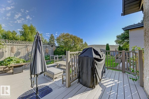 Spacious outdoor deck featuring light-colored wood-finish decking and perimeter railing - 3208 135A Avenue, Edmonton, AB - Outdoor With Deck Patio Veranda With Exterior