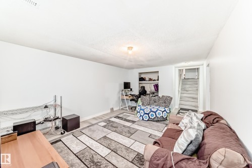 Finished interior space with light-toned wood-finish flooring - 1804 51 Street Nw, Edmonton, AB - Indoor