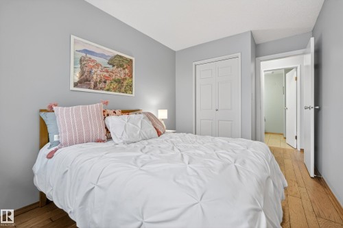The property features a room with light grey walls, a white ceiling, and light-toned wood flooring - 17 Austin Crescent, St. Albert, AB - Indoor Photo Showing Bedroom