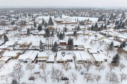 Aerial view of the property and its surrounding neighbourhood, featuring numerous houses with snow-covered roofs and bare trees - 17 Austin Crescent, St. Albert, AB - Outdoor With View
