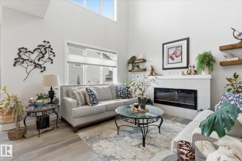 75 Meadowpark Gate, Spruce Grove, AB - Indoor Photo Showing Living Room With Fireplace