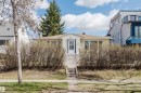 Single-story residence featuring light yellow siding, a white front door with multiple glass panes, and a brown shingle roof - 10511 80 Street, Edmonton, AB  - Outdoor 