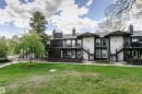 Multi-unit dwelling featuring dark siding and light-colored stucco accents - 9221 172 Street, Edmonton, AB  - Outdoor 