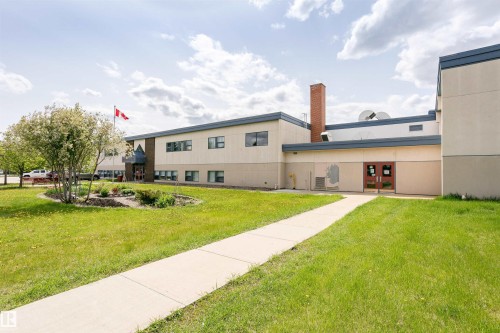 Exterior building with a light-colored facade and dark trim details - 9221 172 Street, Edmonton, AB - Outdoor