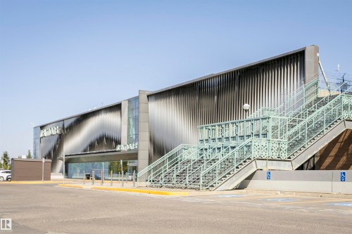 Modern commercial building featuring a corrugated metal facade with a dynamic wave pattern - 9221 172 Street, Edmonton, AB - Outdoor