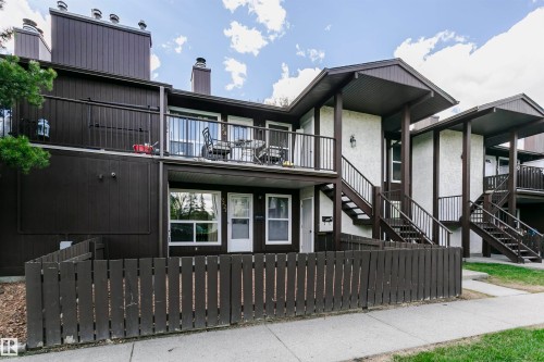 Multi-level residential building featuring brown siding and white stucco accents - 9221 172 Street, Edmonton, AB - Outdoor