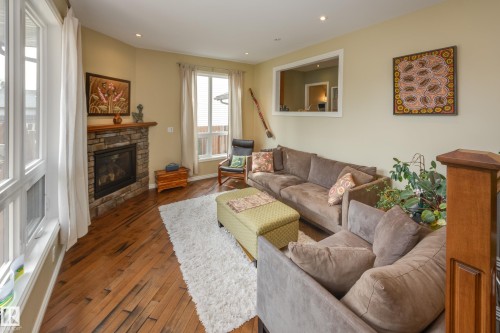 9327 75 Avenue, Edmonton, AB - Indoor Photo Showing Living Room With Fireplace