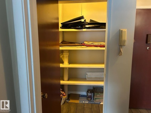 This property features a closet with built-in shelving, providing practical storage solutions - 4 10164 150 Street, Edmonton, AB - Indoor With Storage