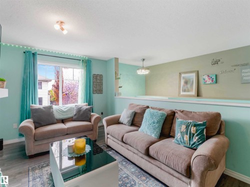 Image quality insufficient for description - 44 1140 Chappelle Boulevard, Edmonton, AB - Indoor Photo Showing Living Room