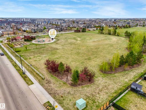 Expansive open field offering significant development potential, bordered by established residential properties - 44 1140 Chappelle Boulevard, Edmonton, AB - Outdoor With View