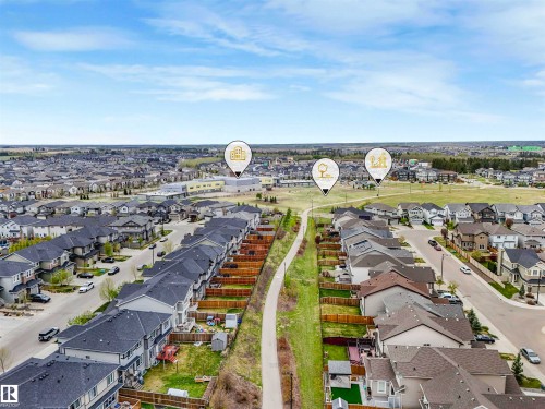 Aerial perspective showcasing a residential community with numerous detached and attached homes - 44 1140 Chappelle Boulevard, Edmonton, AB - Outdoor With View