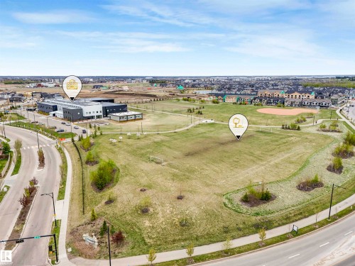 Expansive green space featuring large grassy areas, walking paths, and a baseball diamond - 44 1140 Chappelle Boulevard, Edmonton, AB - Outdoor With View