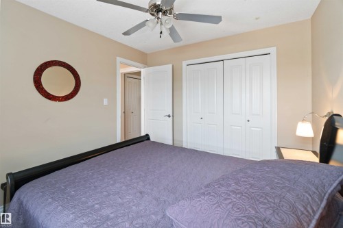 Neutral-toned room featuring a ceiling fan with light fixture, white bi-fold closet doors, and recessed lighting - 6116 53 Avenue, Beaumont, AB - Indoor Photo Showing Bedroom